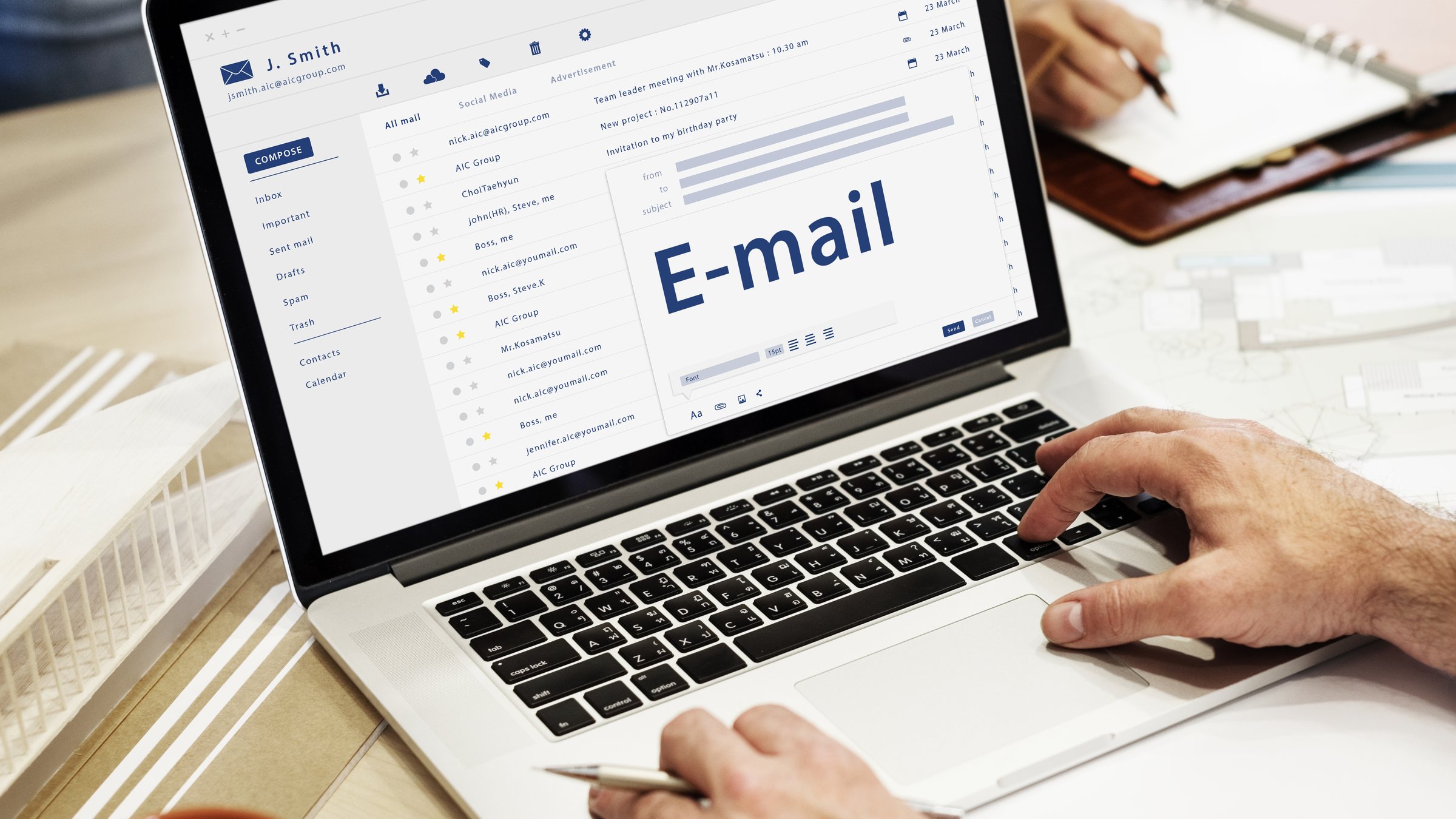 Marketer reviewing email campaigns on a laptop