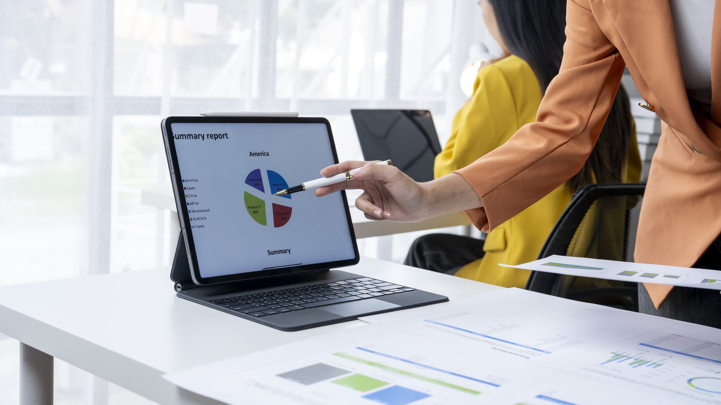 Operations analyst reviewing CRM data charts on a tablet