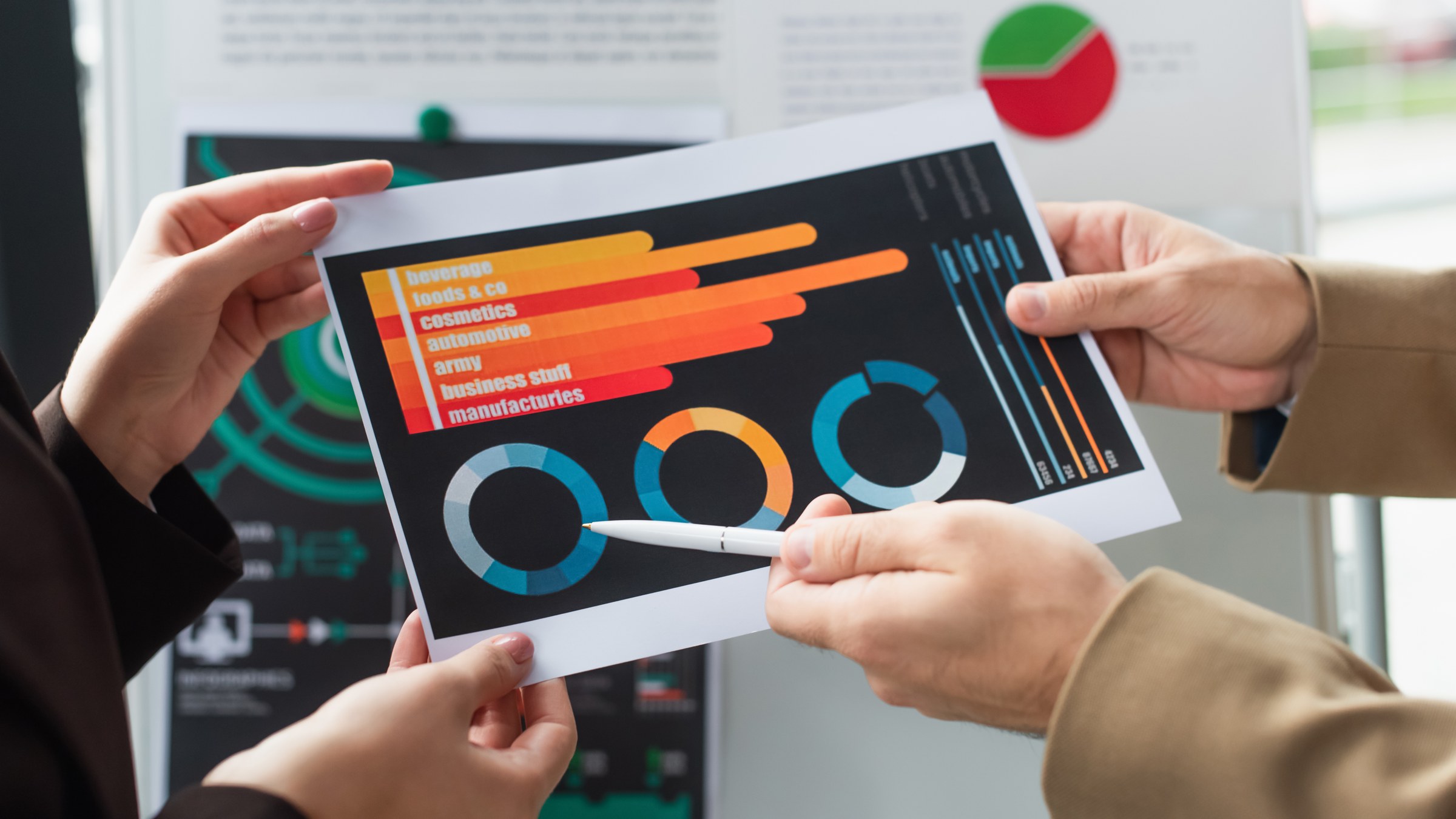 Team reviewing printed marketing analytics dashboards