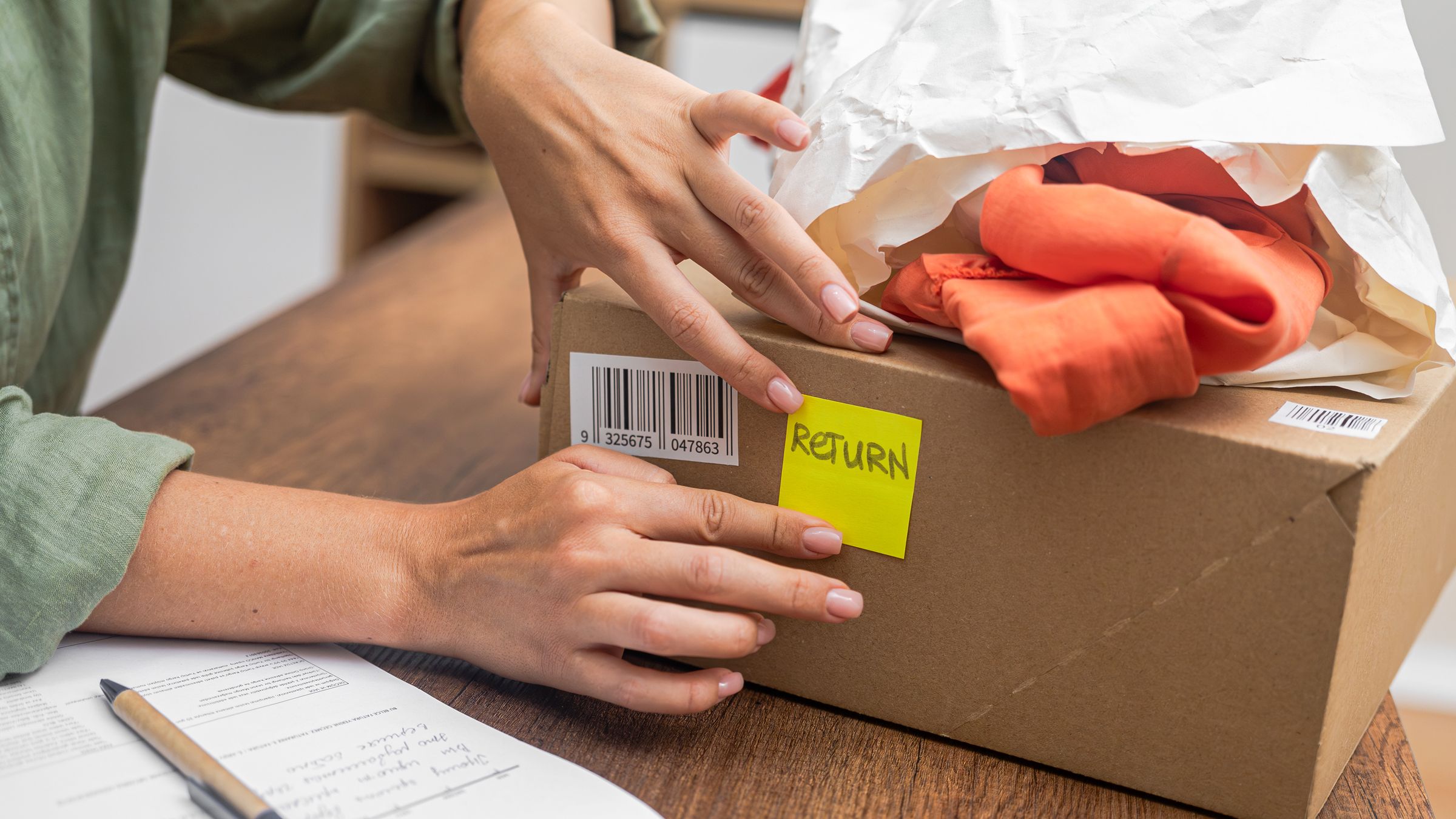 E-commerce worker processing a customer return package